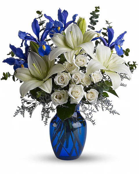 Bouquet of flowers with blue and white flowers in a blue vase on a white background