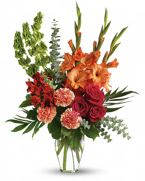 Assorted flowers in transparent vase