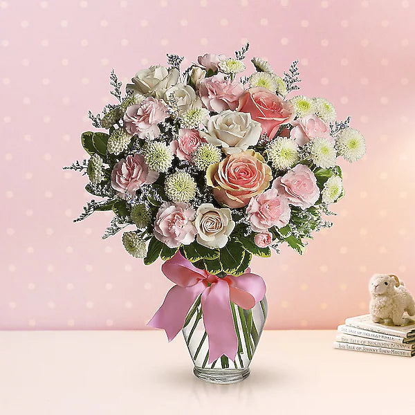 Lovely pink and white flowers in vase for weddings or gifts.