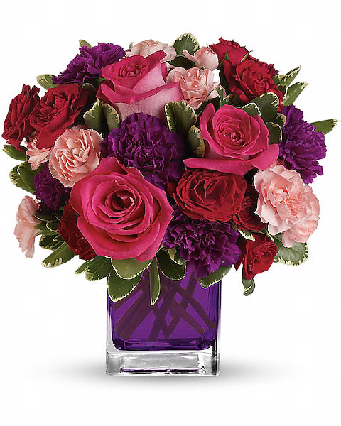 Colorful flower arrangement with red, pink, and purple flowers 